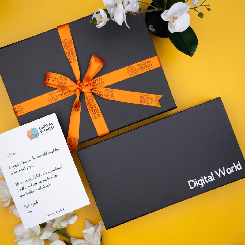 Branded gift box with a printed ribbon and a personalised message card