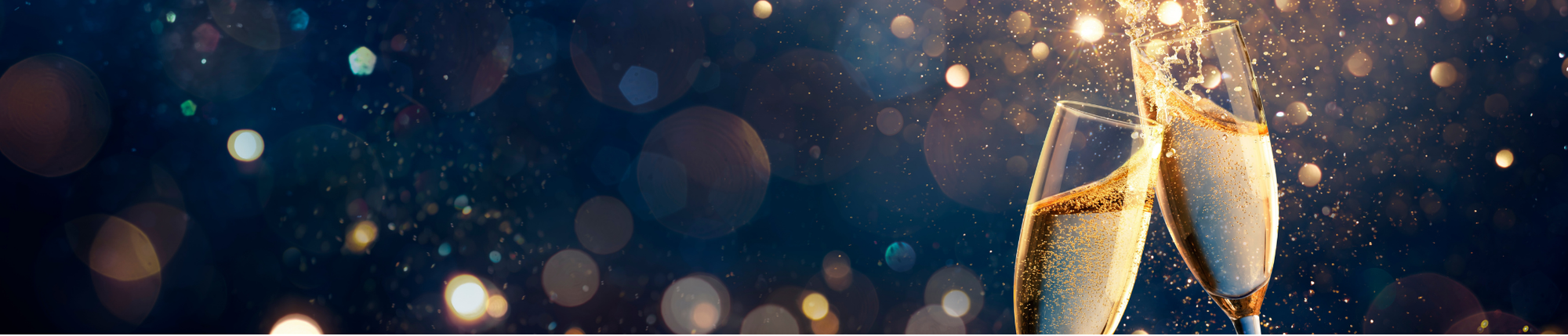 Two champagne glasses clink together with bubbles rising, surrounded by golden, sparkling bokeh lights on a dark, festive background.