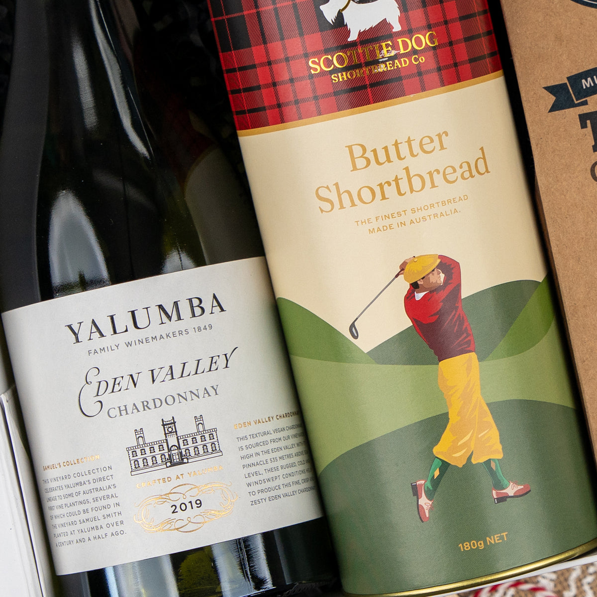 Gourmet Feast and White Wine: white wine and a tin of Scottie Dog Butter Shortbread