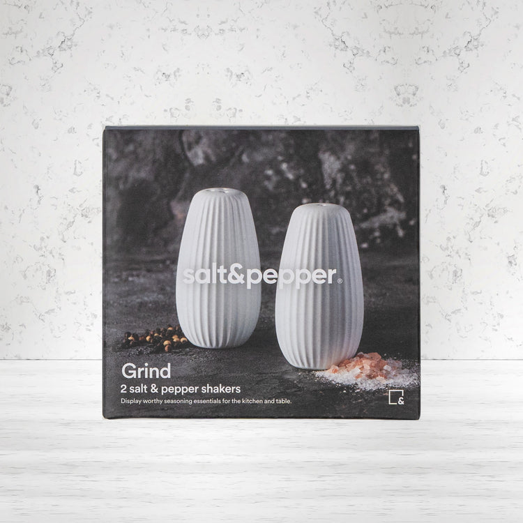 Salt and pepper shakers set: classic design, efficient grind. Essential for dining. White finish. Perfect table accessory.