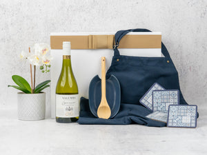 Elevate your kitchen with this Gourmet Cooking Hamper, featuring fine wine and stylish essentials. Perfect for any home chef!