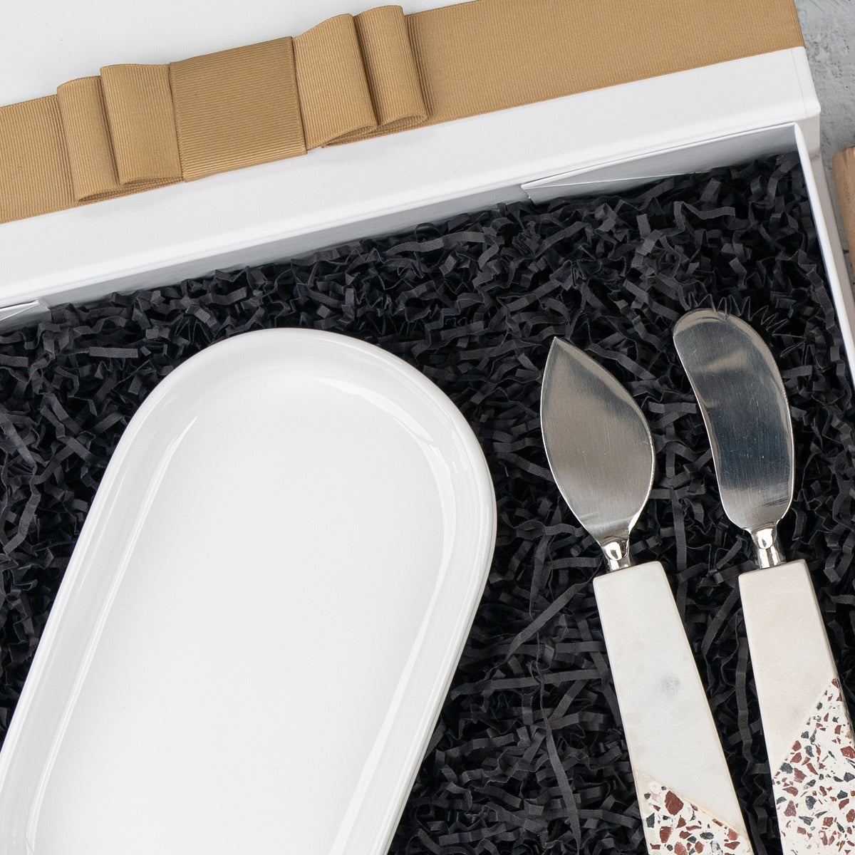 Luxe Homeware Hamper: white ceramic dish and two terrazzo-handled cheese knives