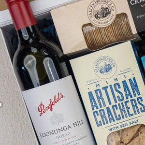The Hamper Boutique Co Deluxe Grazing Gift Hamper includes Penfolds Koonunga Hill Shiraz, Valley Produce Co. mini artisan crackers, and Valley Produce Co. crackers—perfect for gifting any occasion.
