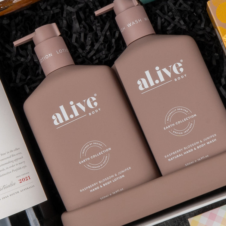 The Deluxe Wine and Relaxation Hamper by The Hamper Boutique Co features two luxurious bottles side by side in a stylish tray.