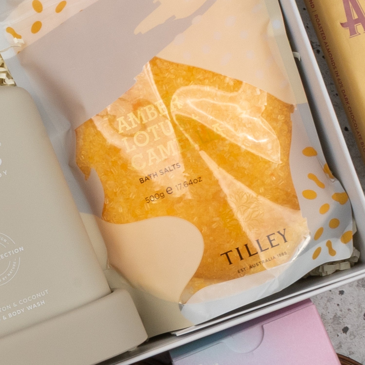 A close-up of a Veuve Clicquot Premium Celebration Hamper by The Hamper Boutique Co, featuring a selection of bath and body products arranged in a stylish box.