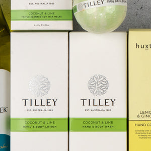 Close-up of The Hamper Boutique Co's White Wine and Self-Care box on a gray surface.