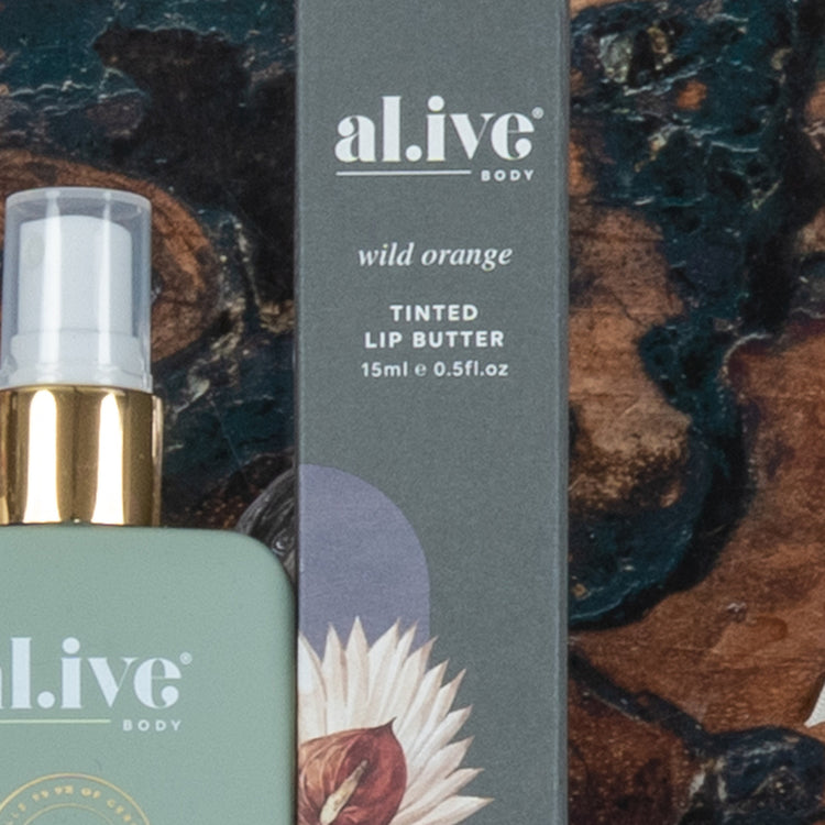 A close-up of The Hamper Boutique Co’s Chardonnay and Self-Care Hamper, with its packaging partially visible against a dark, textured background.