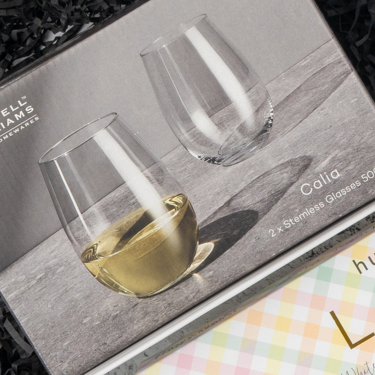 White Wine and Relaxation: two 500 ml stemless glasses, one with white wine