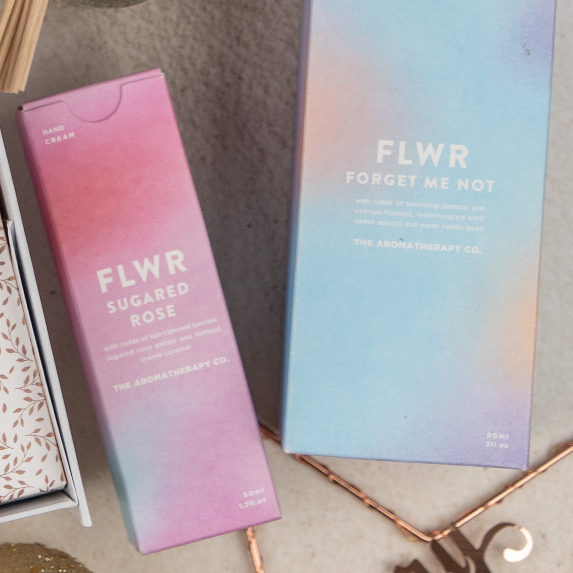 A pastel-colored product box from The Hamper Boutique Co, labeled Sparkling Comfort & Joy, is shown.