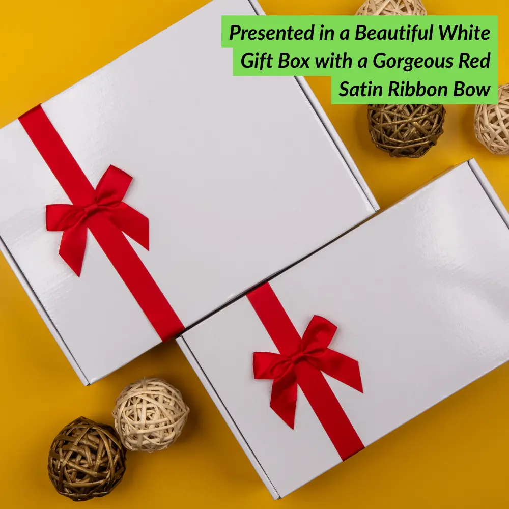 Two Glenmorangie Moments Hampers by The Hamper Boutique Co are displayed on a yellow background with red satin bows and decorative woven balls. A green label reads, Presented in a Beautiful White Gift Box with a Gorgeous Red Satin Ribbon Bow.