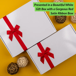 Two Glenmorangie Moments Hampers by The Hamper Boutique Co are displayed on a yellow background with red satin bows and decorative woven balls. A green label reads, Presented in a Beautiful White Gift Box with a Gorgeous Red Satin Ribbon Bow.
